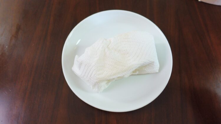 wrapping tofu with paper towels
