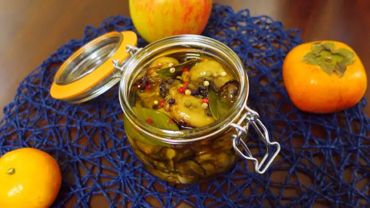 oil marinated oysters in a jar seen from above