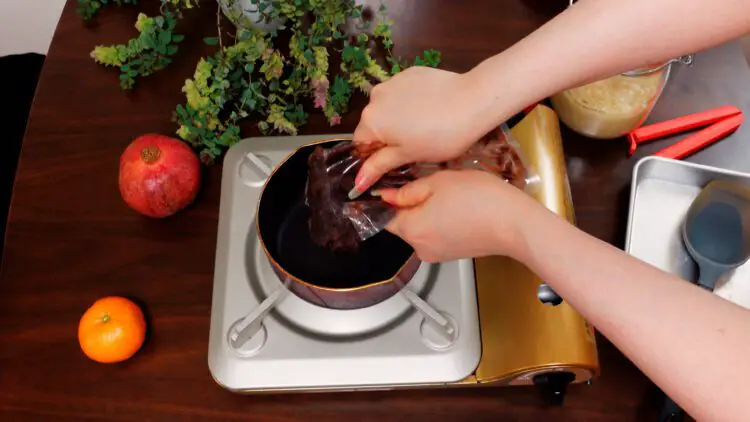 Add sweetened red bean paste into a small pan