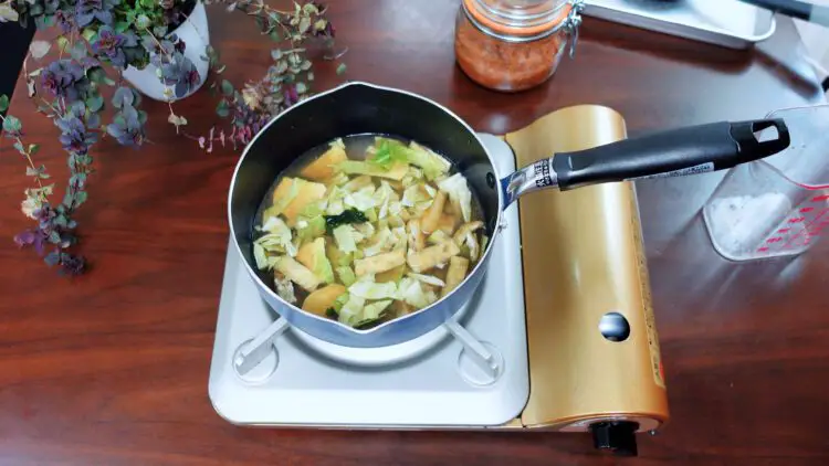 add water dashi powder and all the other ingredients except miso into a pot