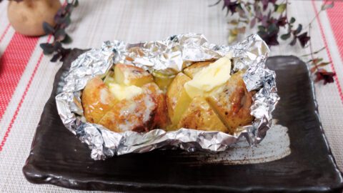 potato with butter on a plate