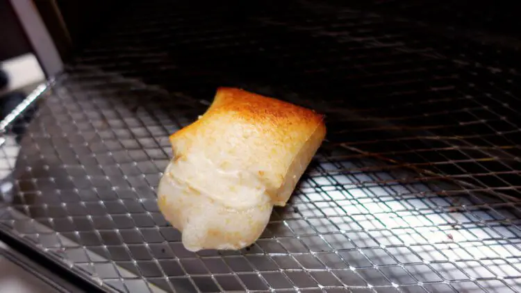 rice cake is puffy and lightly charred at the top