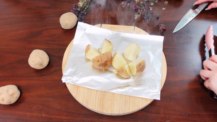 use a knife to cut an X across the top of each potato