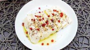 Shio-Koji-Marinated Tofu served on a plate with olive oil