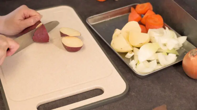 Chop onion, carrot, and potatoes into bite size pieces