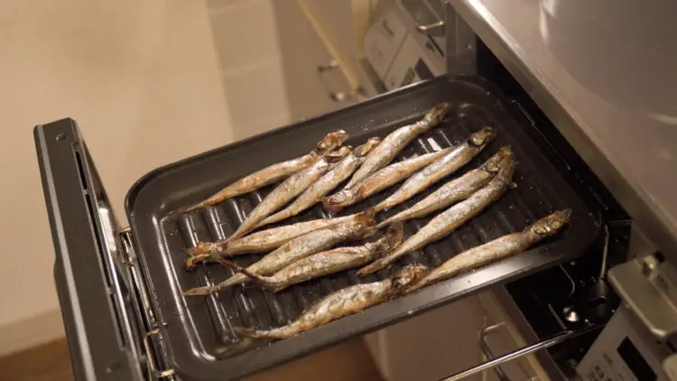 Cook the fish in/on the grill for about 7 minutes until their skin turn a bit crispy and golden brown