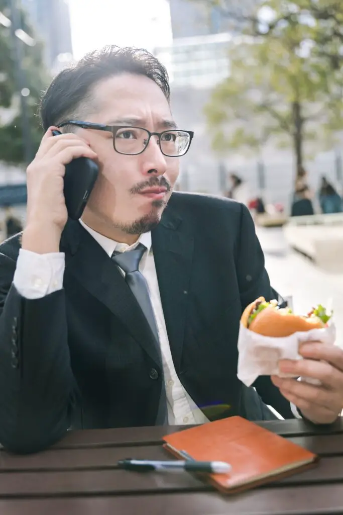 office worker eating burger