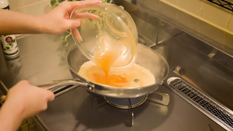 Add the egg mixture to the pan and spread it across the pan