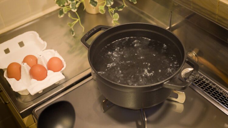 Add water to a pot and bring the water to a boil