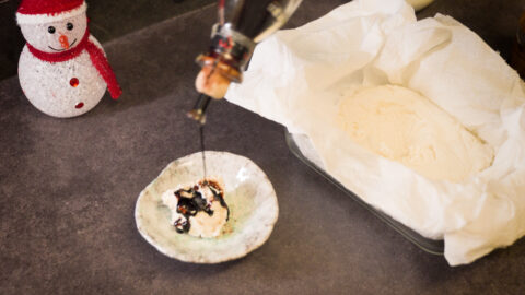 drizzling balsamic vinegar over kefir