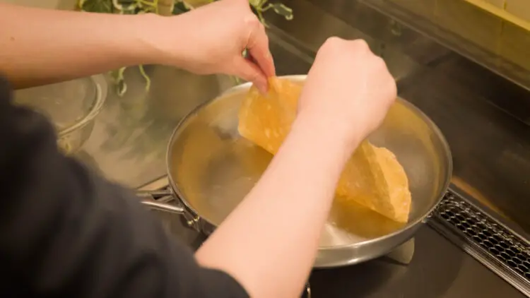 flip it over and allow it to cook the other side with the residual heat