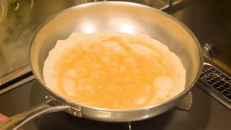 Once the egg mixture is spread across the pan, stop the heat