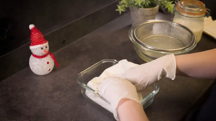 place it in a container, and wait for the whey in the cheese to be absorbed by the paper towel