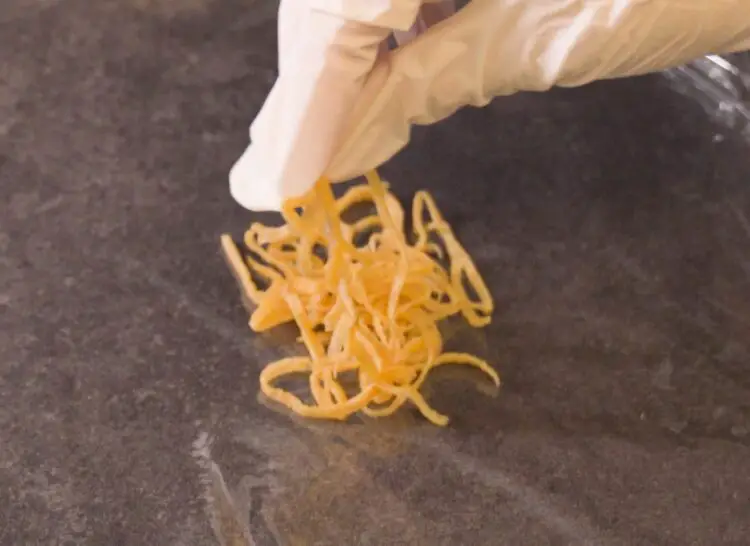 placing Egg (Kinshi Tamago) on a plastic wrap