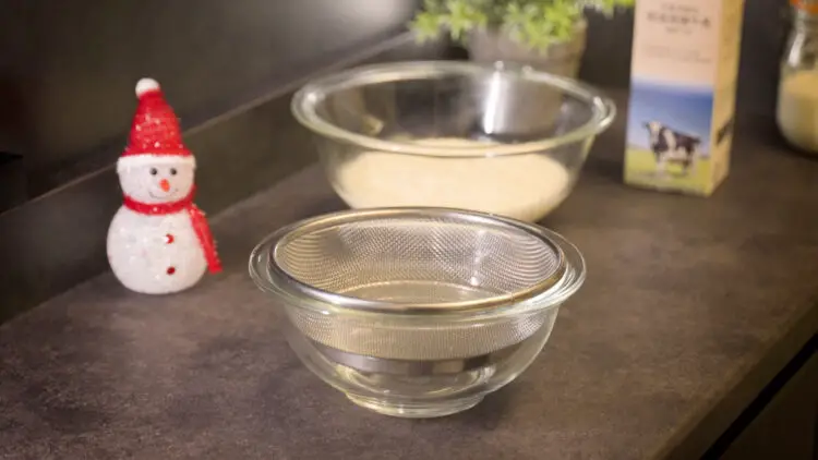 Set a strainer over a bowl