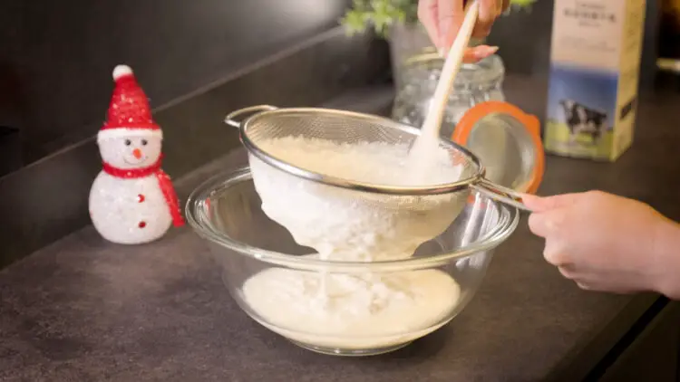 straining kefir with a strainer