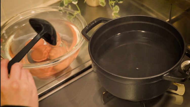 Take out the eggs from the pot and transfer them to the cold water