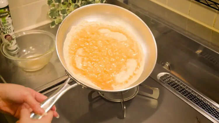 the egg mixture is spread across the pan
