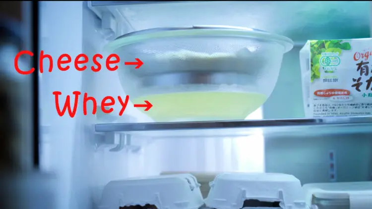 The liquid (whey) starts dripping into the bowl, and kefir cheese starts forming inside the cloth