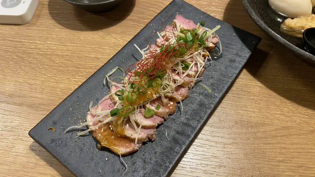 duck carpaccio on a plate