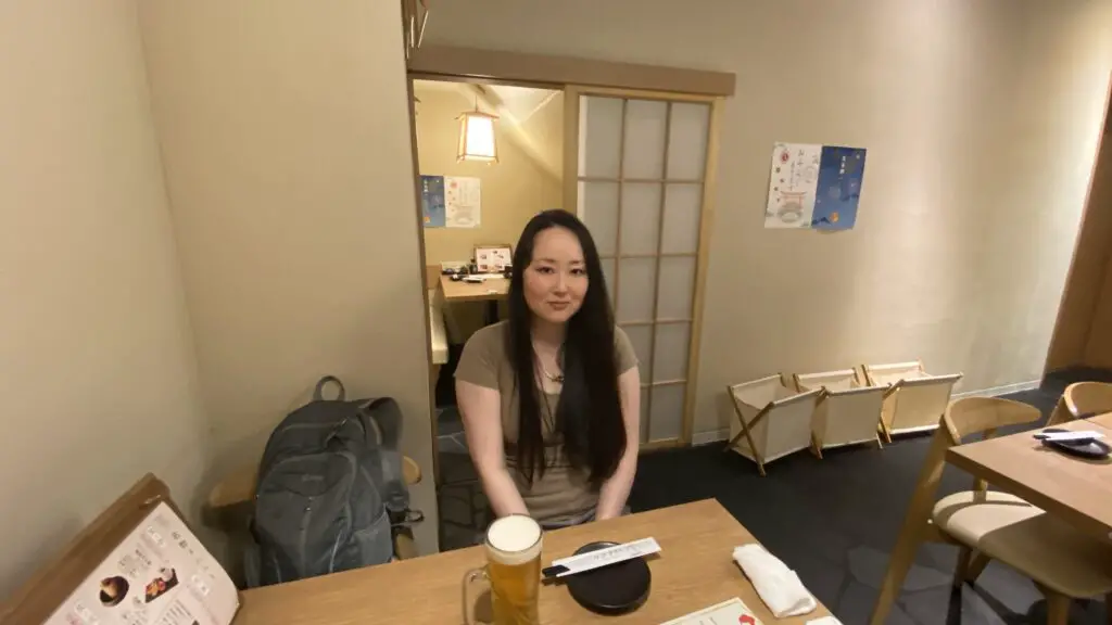 sakura yubi sitting at table in torii kuguri