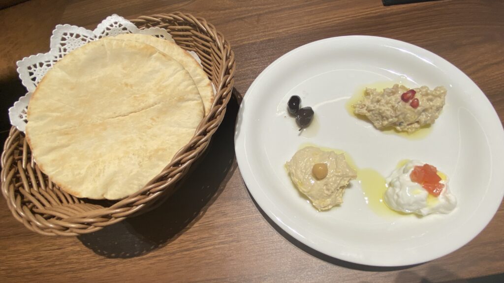 Assorted dip plate - We loved this! The bread was served piping hot. The one with smoked eggplant (upper right) was especially amazing!