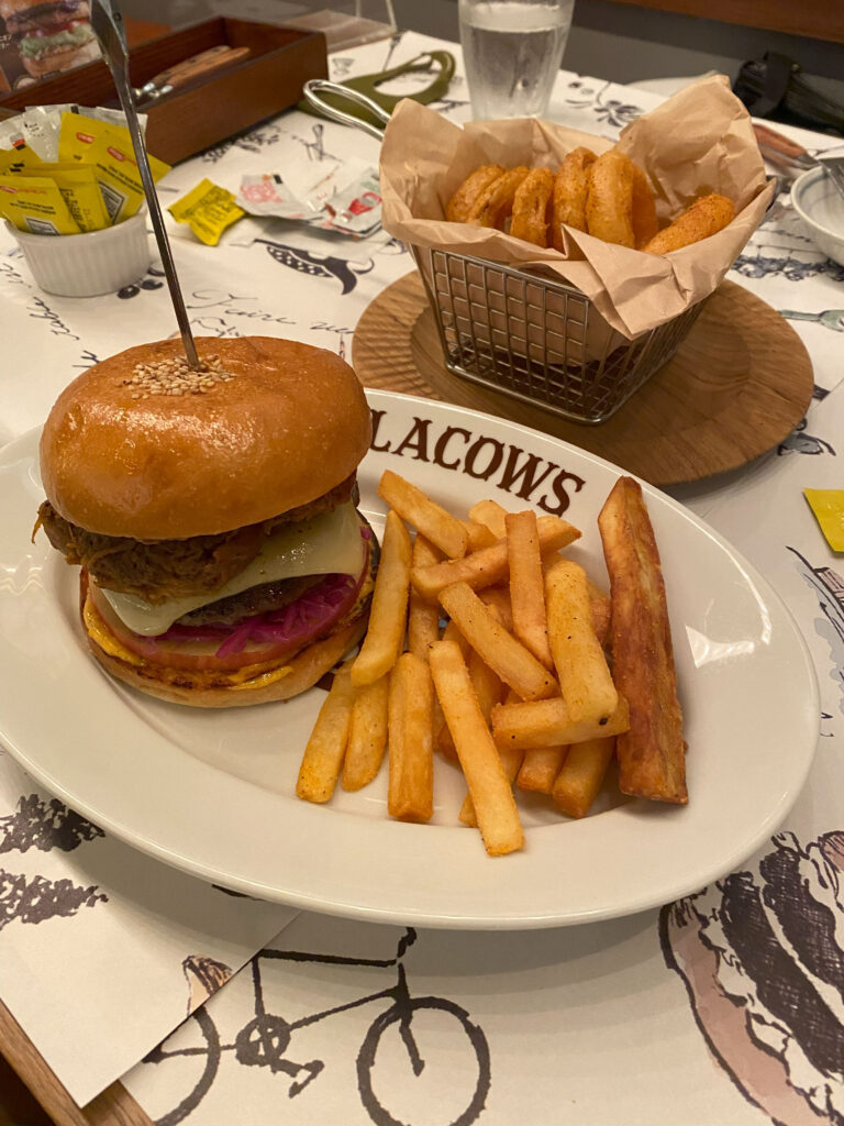 a seasonal special burger with fries and onion rings at Blacows