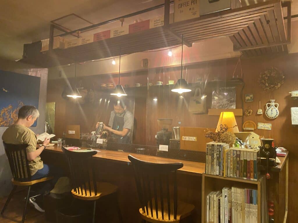 barrister making coffee in Egota Coffee Roaster