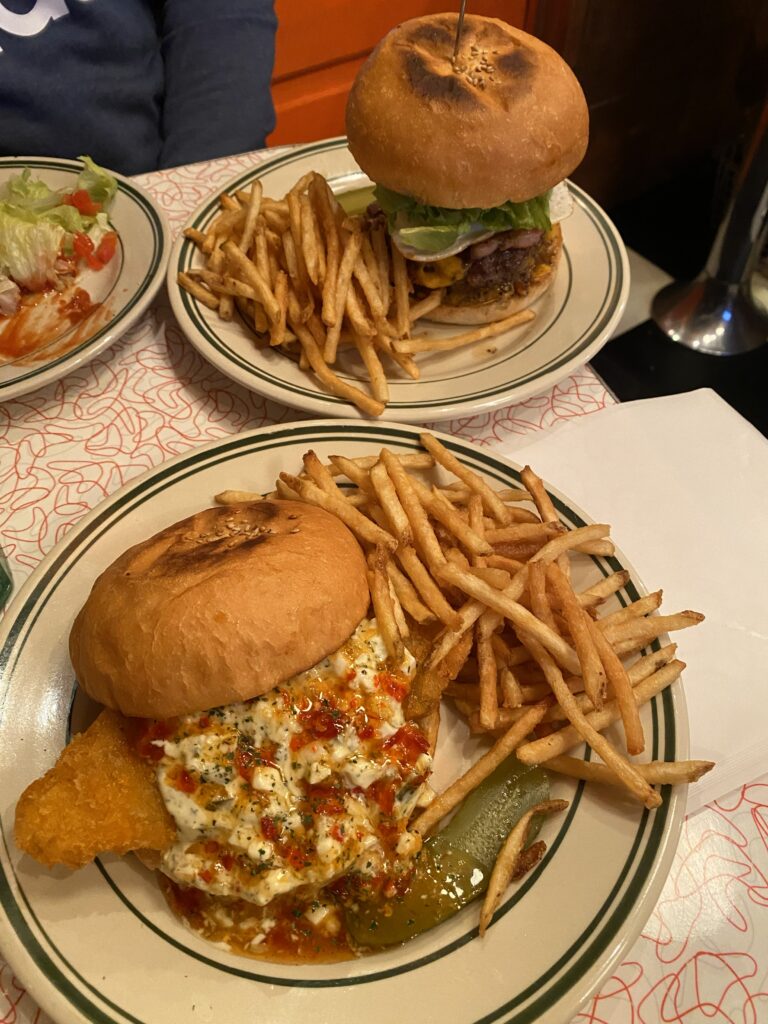 two plates of burgers on a table at BASHI BURGER CHANCE Ikebukuro
