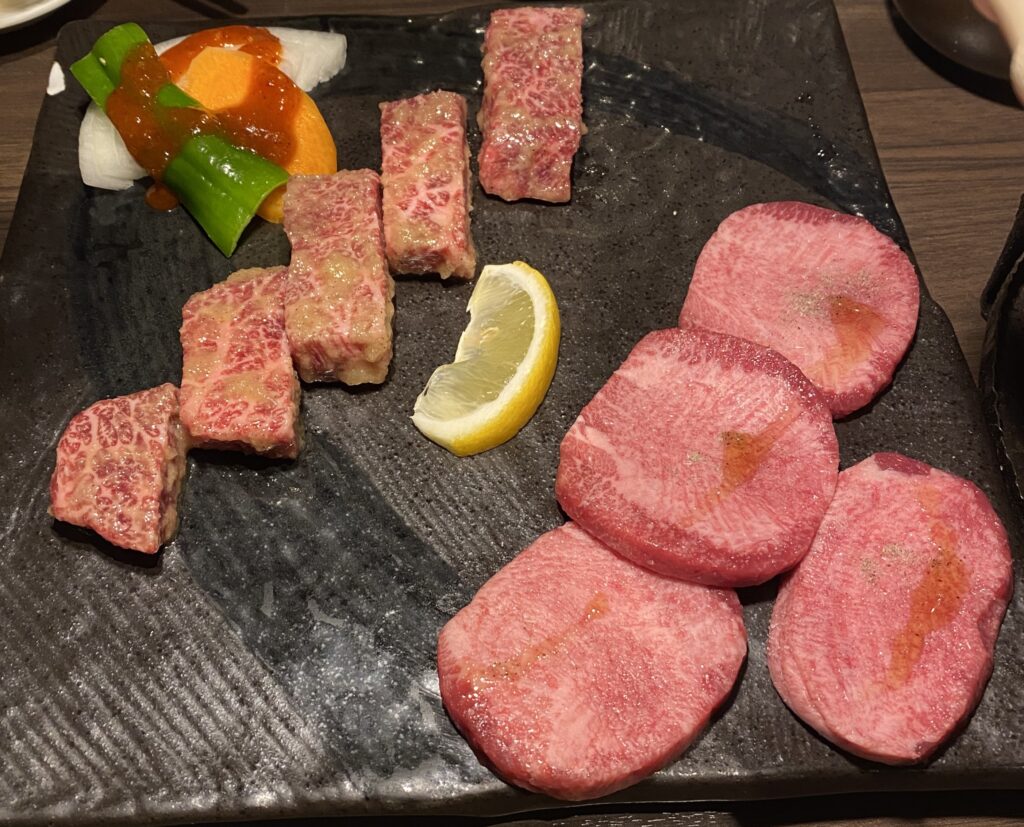 wagyu and beef tongue slices on a plate at Koei Shinjuku Honten
